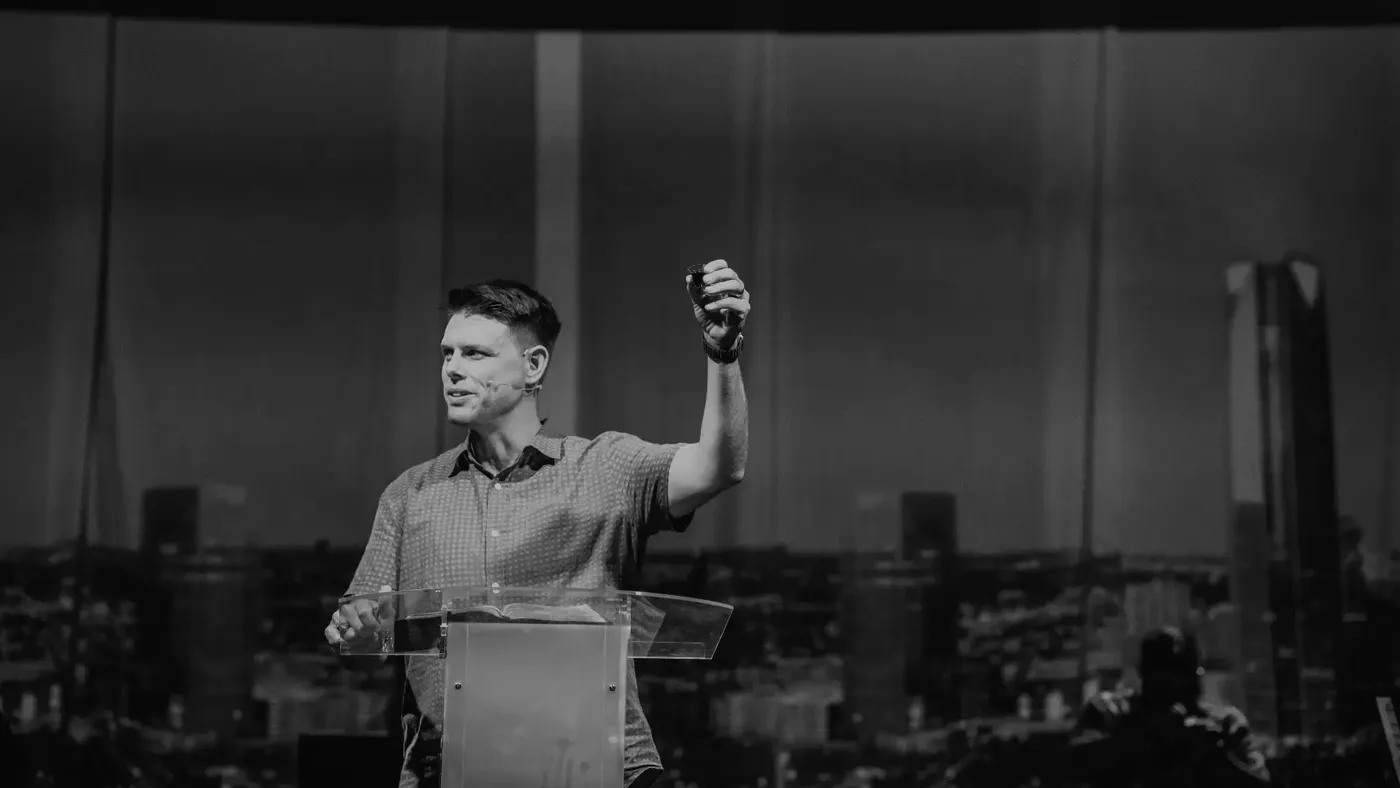 Michael Rowntree preaching with arm raised